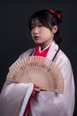 Young Woman in Kimono with Fan