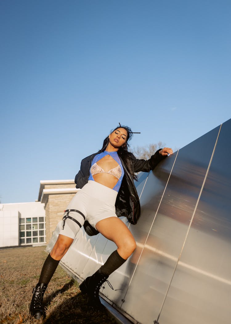 Woman In Stylish Clothing Posing On Roof