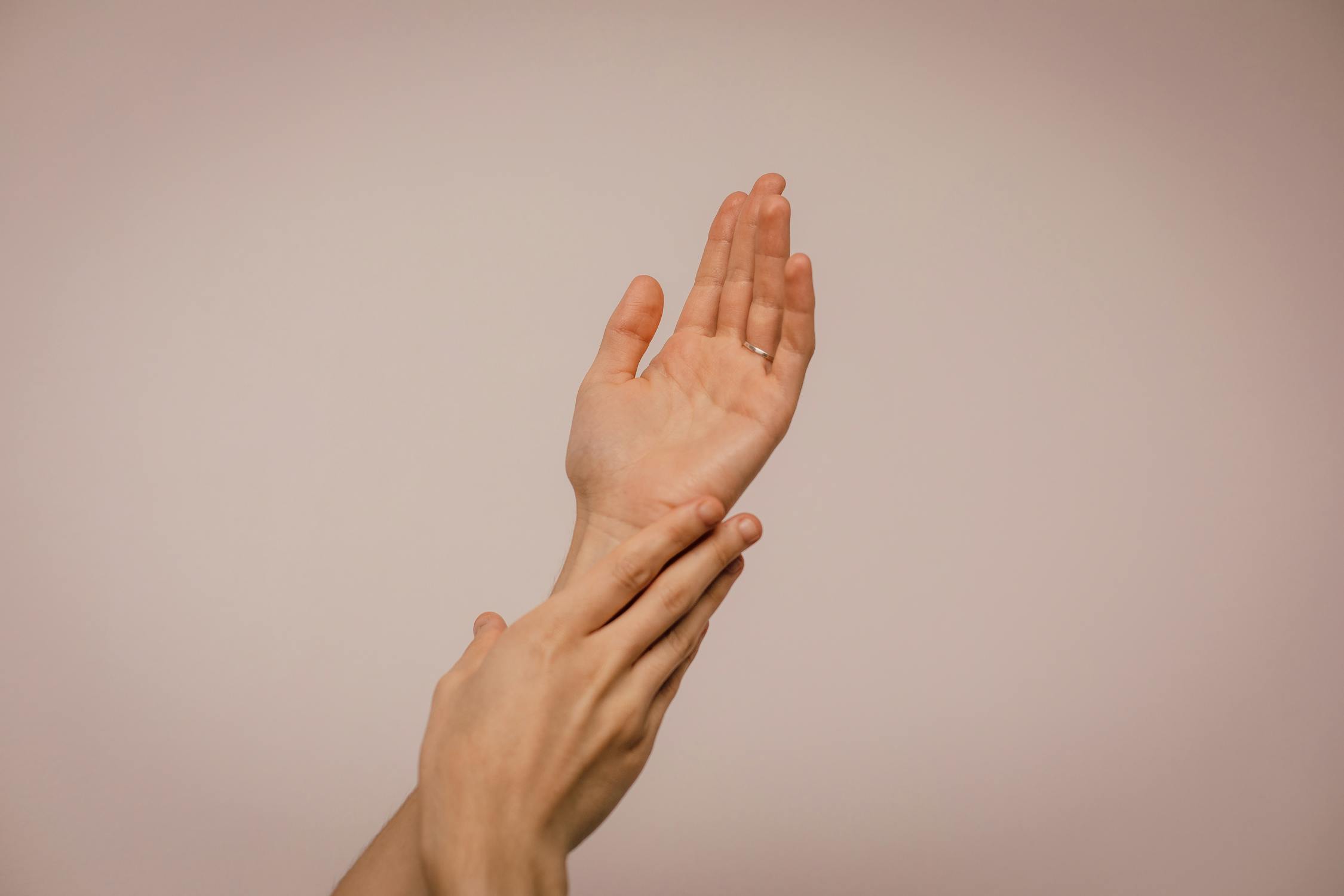 Image of a person touching hand