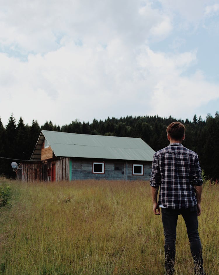 A Man Looking At A House