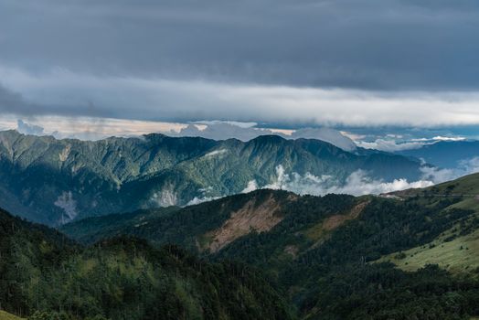 Scenic mountain range under cloudy sky, showcasing natural beauty outdoors.