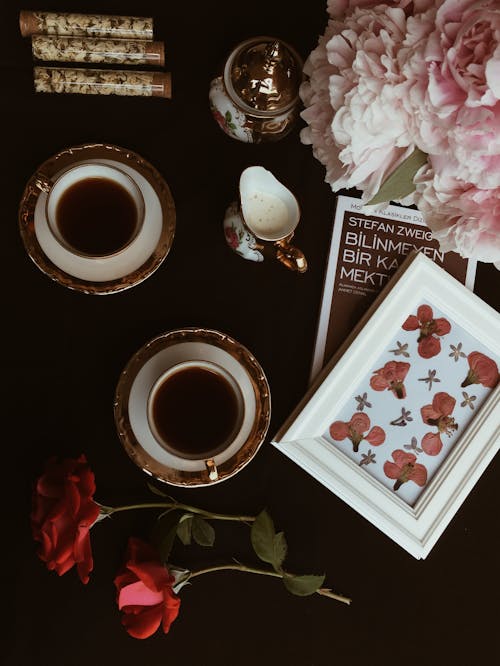 Top View of Coffee Cups and Flowers