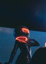 Person in Black Pants and Red Mask