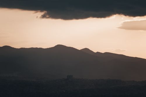 Free Majestic silhouette of İzmir's mountains under a dramatic sunset sky. Stock Photo
