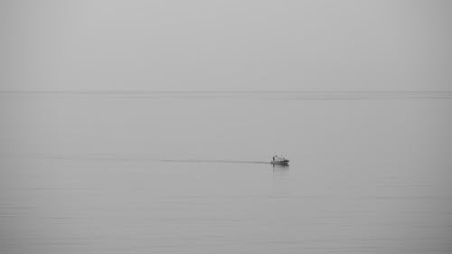 A Boat Sailing on the Calm Sea 