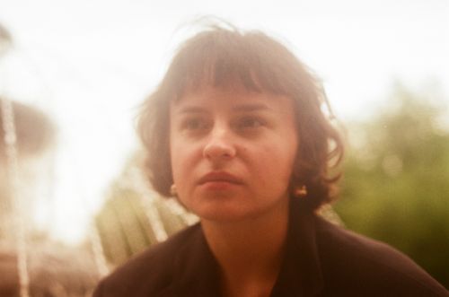 Free A close-up portrait of a woman outdoors with a thoughtful expression. Stock Photo