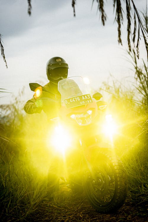 A Person Riding an Off-Rod Motorcycle with Bright Lights