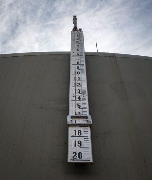 Free Low angle view of a large vertical thermometer on a building exterior. Stock Photo