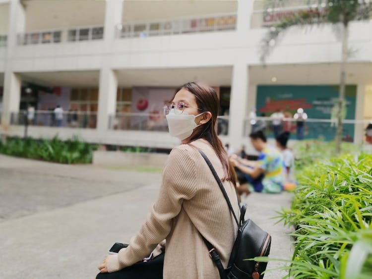 Woman In Mask And Eyeglasses