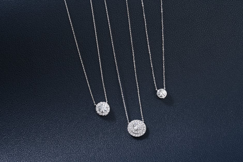 A collection of various diamond pendant styles including solitaire, halo, and cross designs A collection of various diamond pendant styles including solitaire, halo, and cross designs