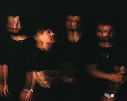 Innovative portrait of four men against a black backdrop with motion blur effect, conveying surrealism.