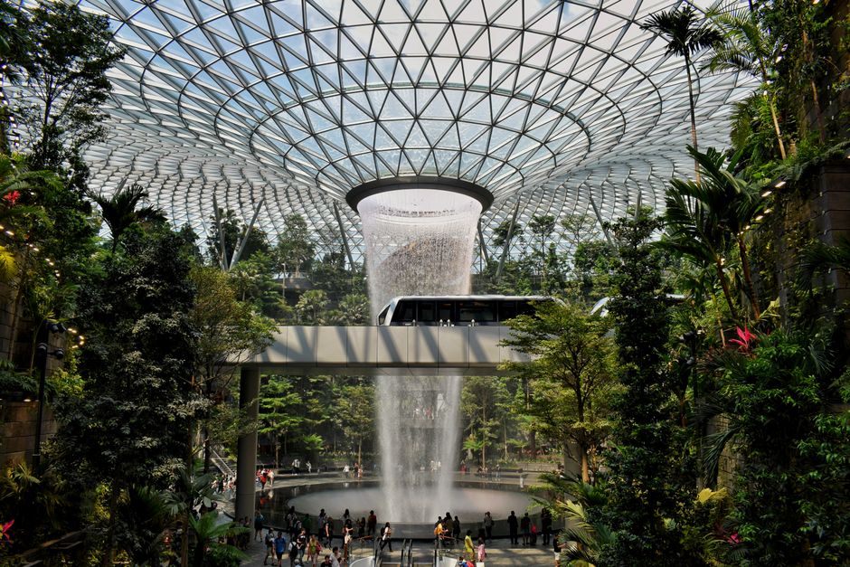 Breathtaking view of the HSBC Rain Vortex waterfall at Jewel Changi Airport, Singapore.