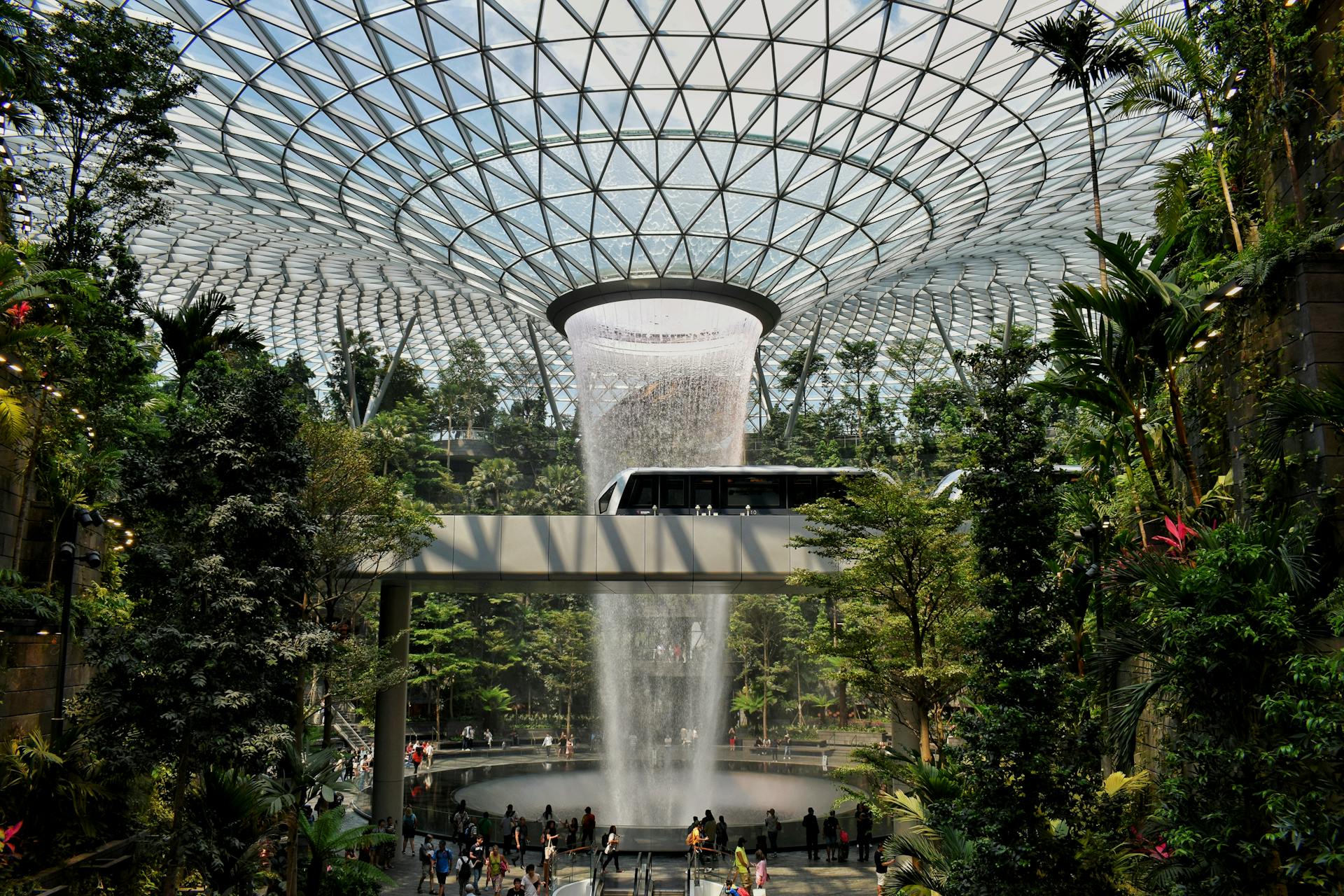 Breathtaking view of the HSBC Rain Vortex waterfall at Jewel Changi Airport, Singapore.