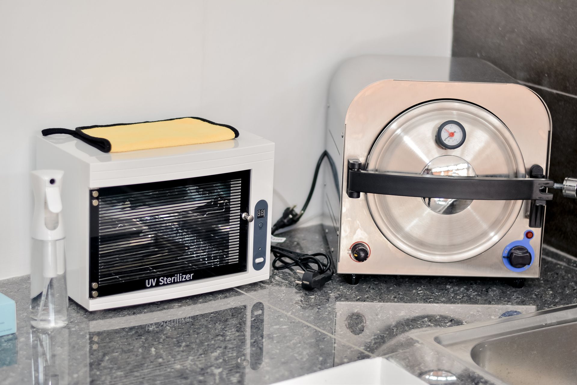 Professional UV sterilizer and autoclave setup in a clean laboratory environment.