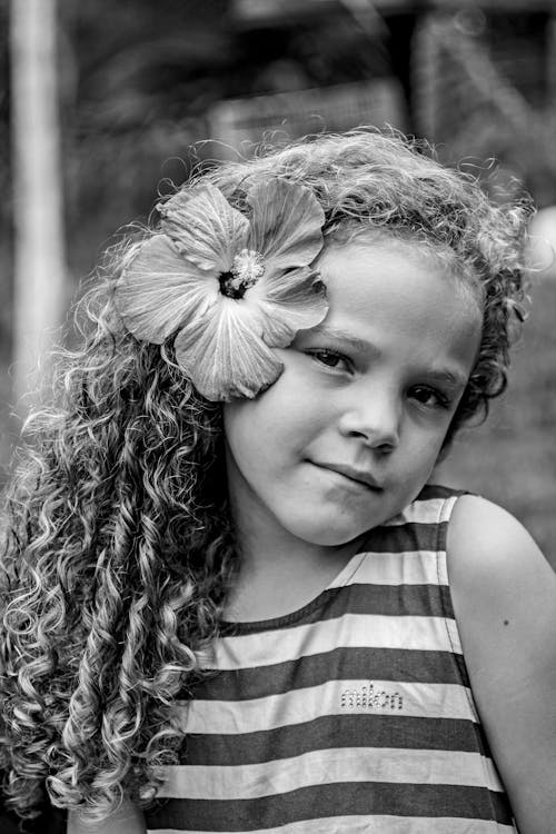 Black and White Portrait of a Young Girl with a Flower in her Hair 