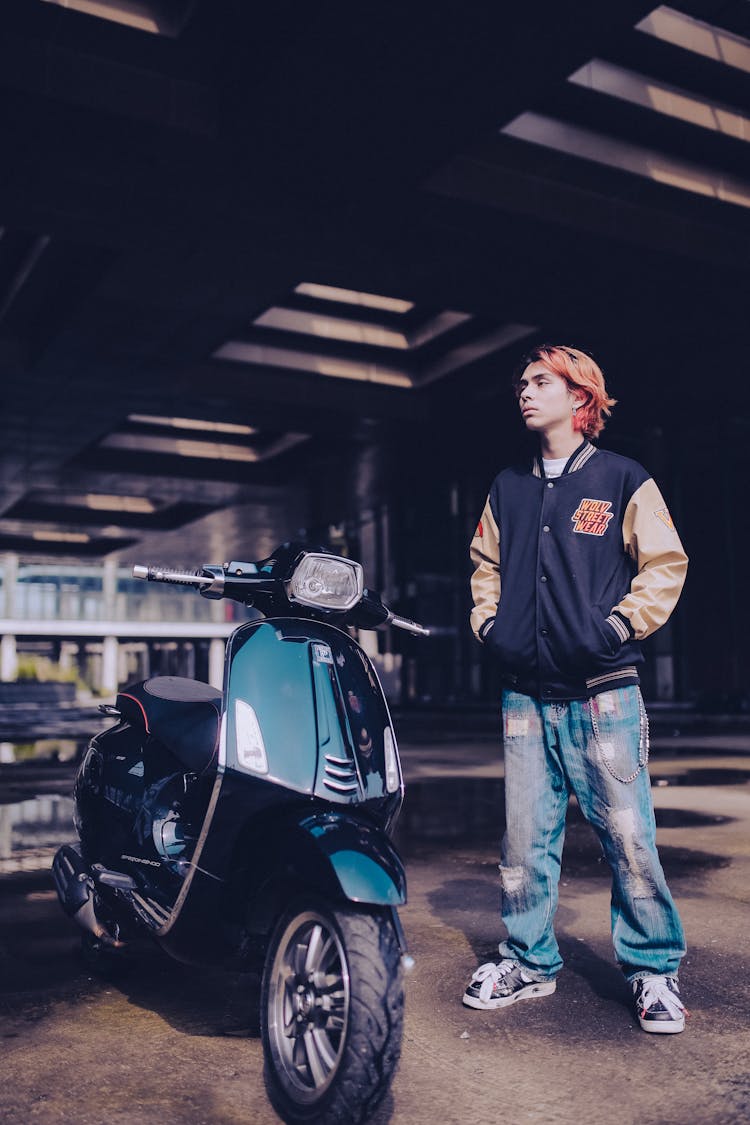 Photo Of A Teenager Boy And A Scooter