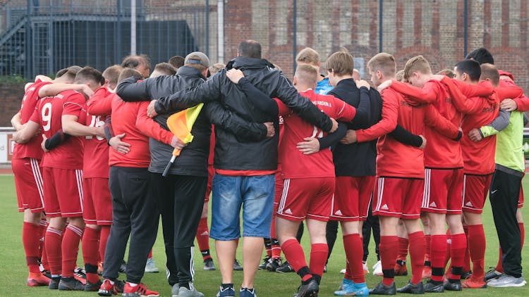 Soccer Team Standing In Circle