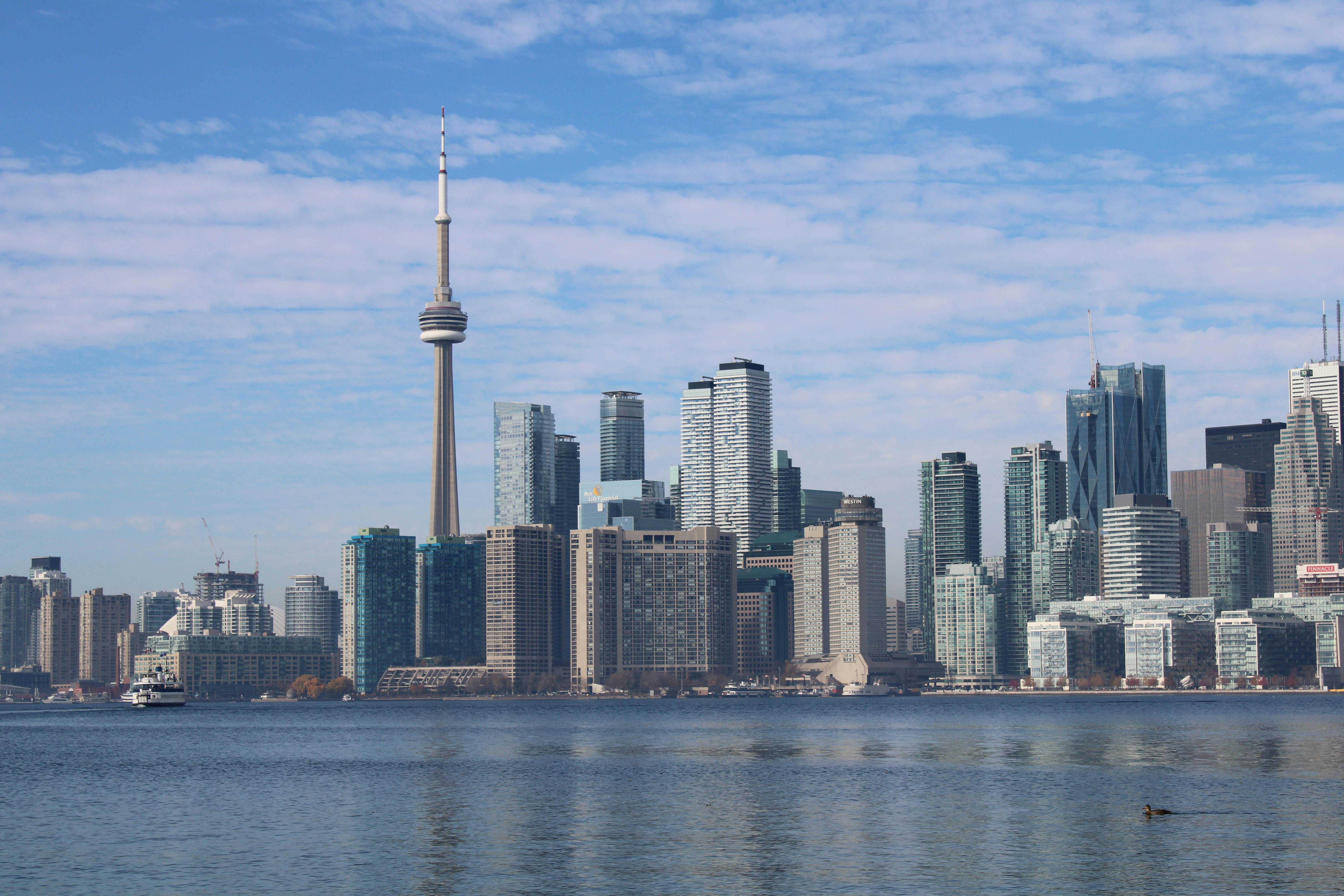 Toronto cityscape with CN Tower and skyscrapers at dusk
