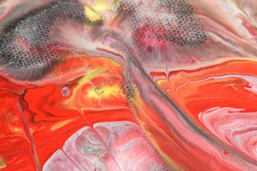 Dynamic abstract art featuring bold red and orange acrylic paint with intricate patterns.