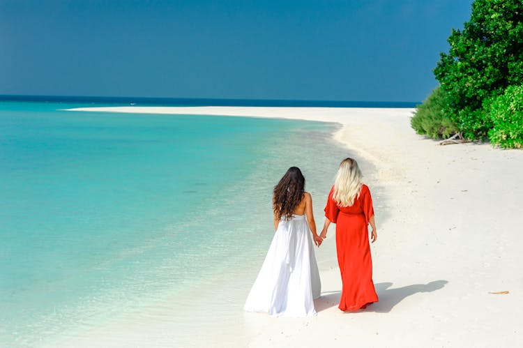 Women Walking On The Beach