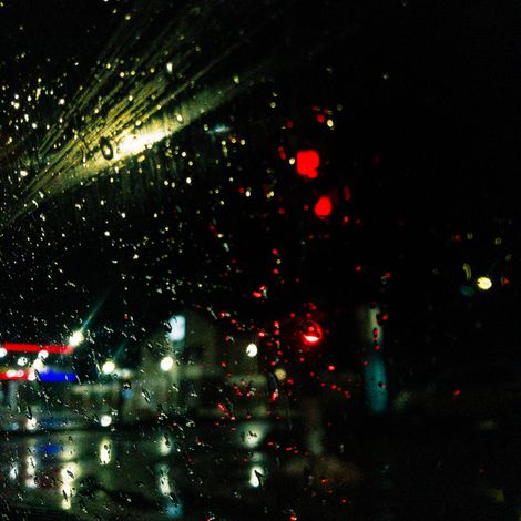 Rain on glass over city lights, Serge Cyneat on Pexels