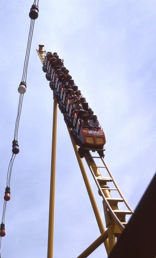 People Riding a Roller Coaster