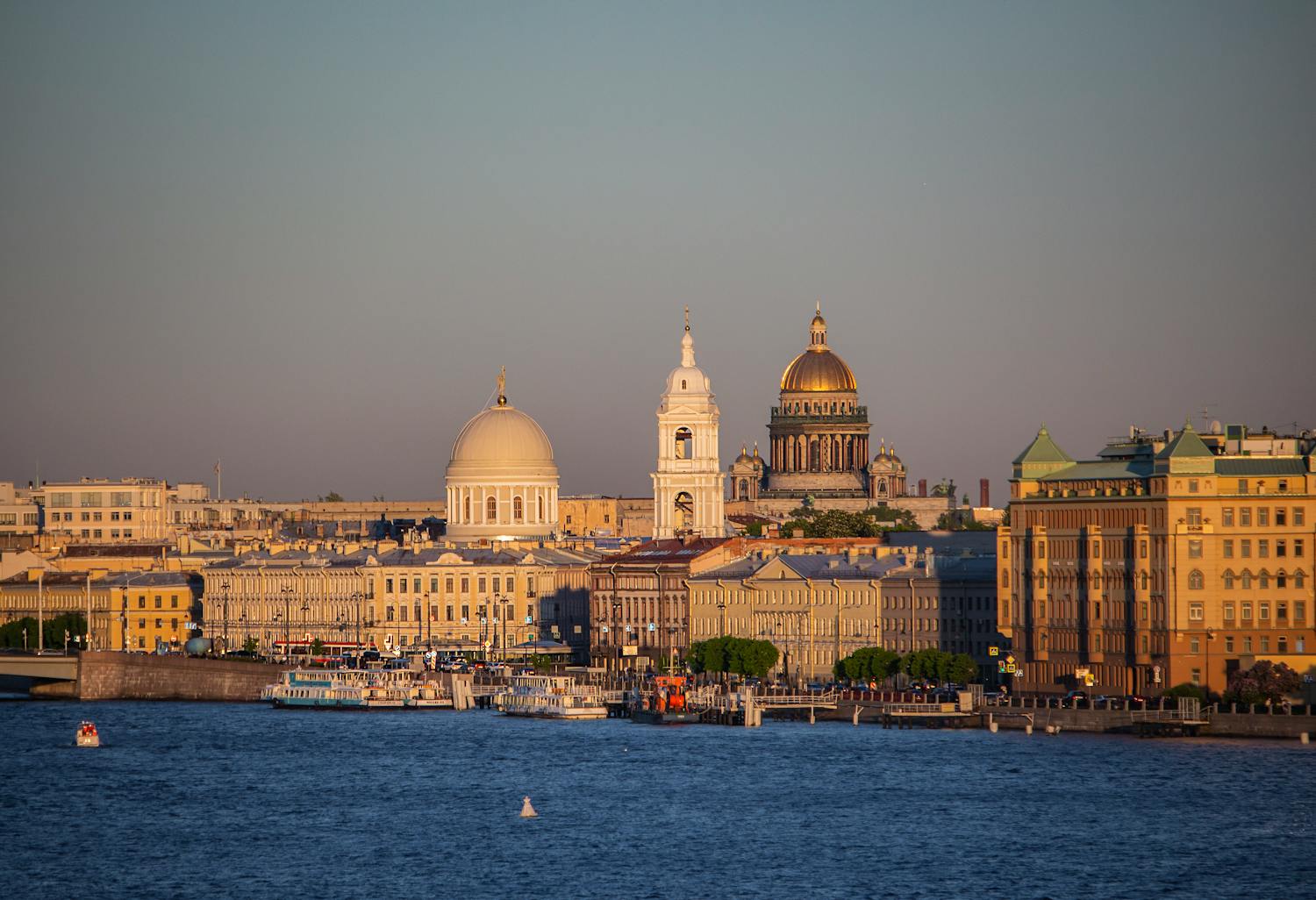 Serene view of St. Petersburg's waterfront with the iconic St. Isaac's Cathedral
