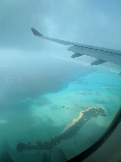 Free A stunning aerial view of a beautiful Maldives island taken from an airplane window. Stock Photo