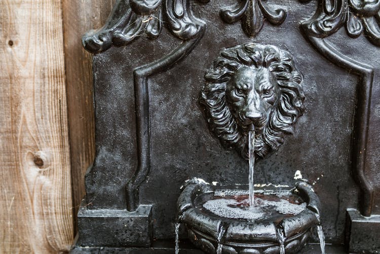 Brown Wall Fountain In Close-up Photography