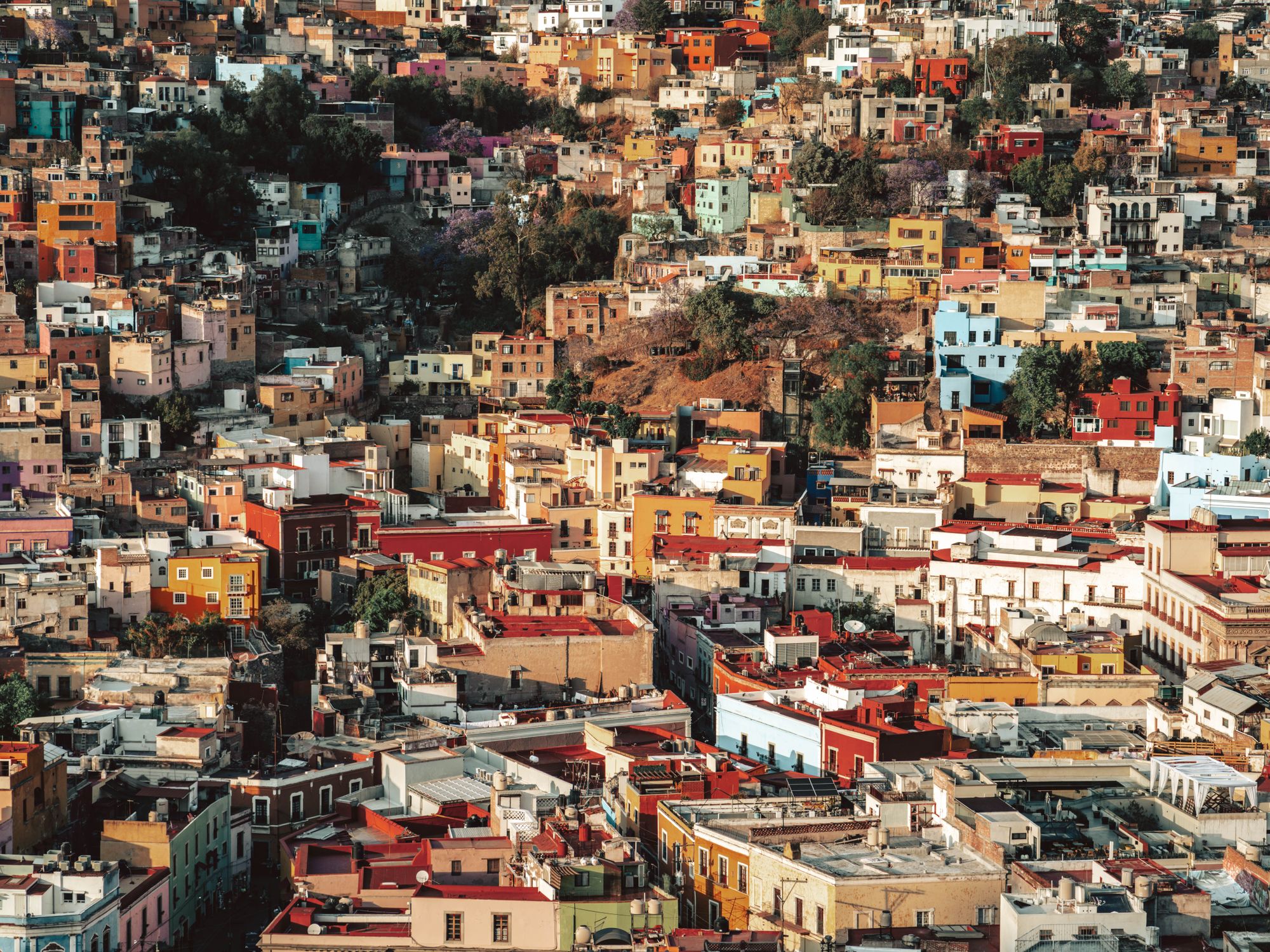 Colorful houses and architecture of Guanajuato City, Mexico, create a vivid cityscape.