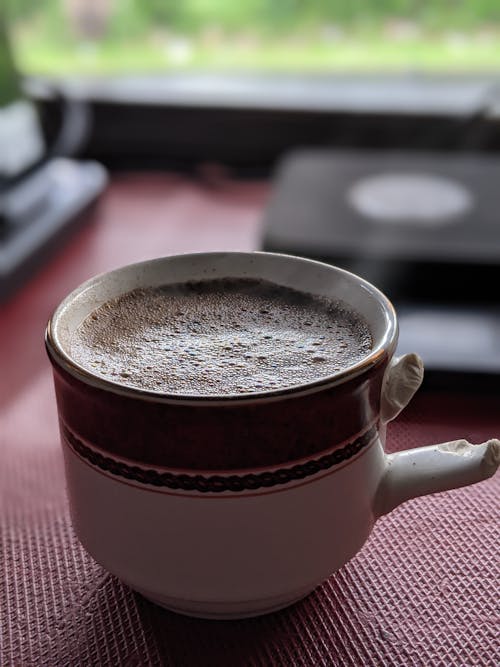 Free Coffee in a Cup with a Broken Handle Stock Photo