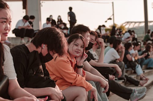 People Sitting on a Pavement