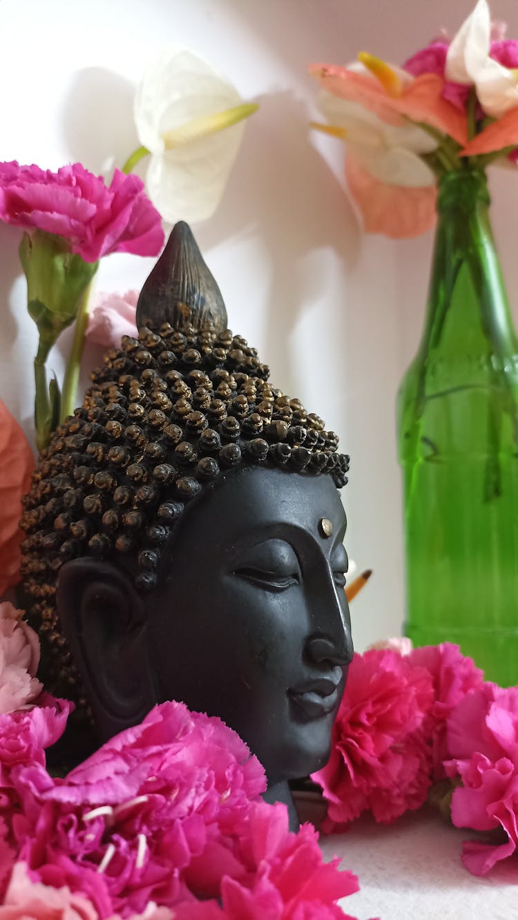 Buddha Head Surrounded With Pink Flowers