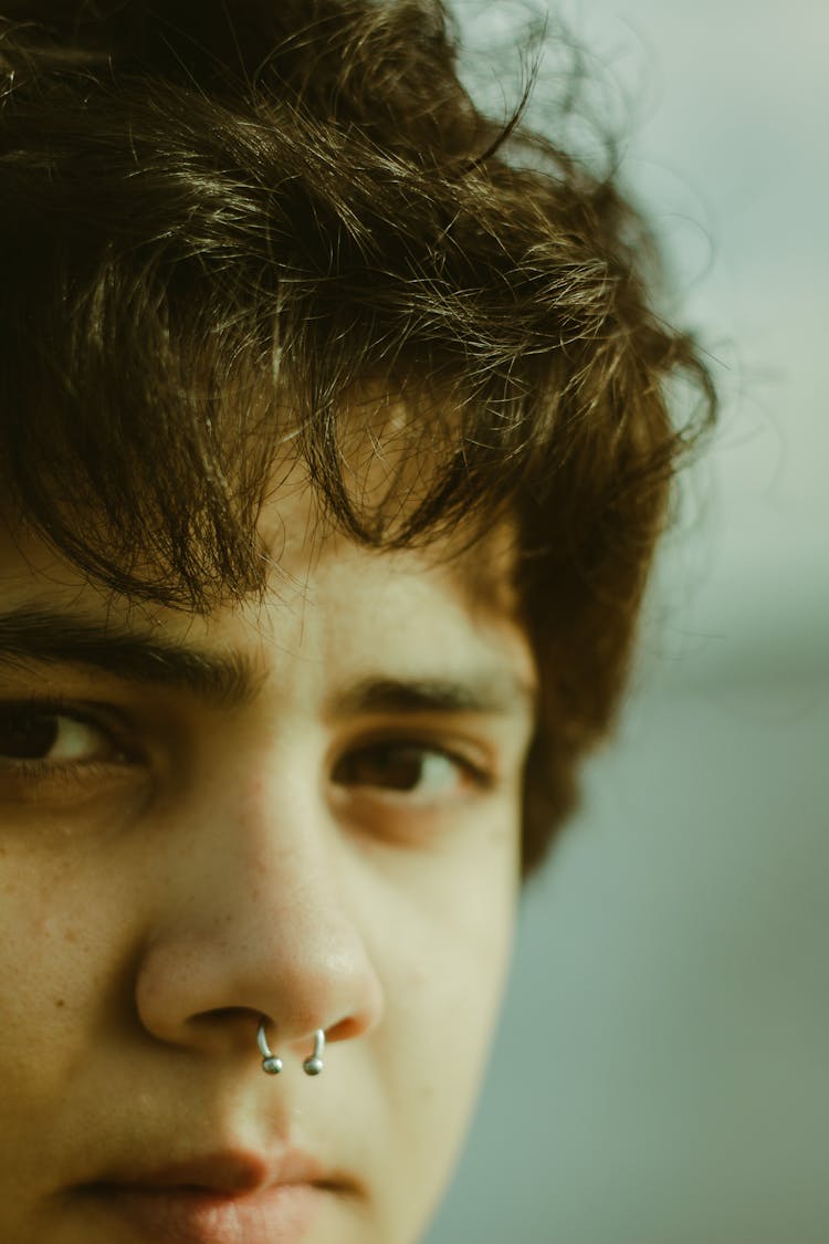 Close-up Photo Of A Man With Nose Piercing