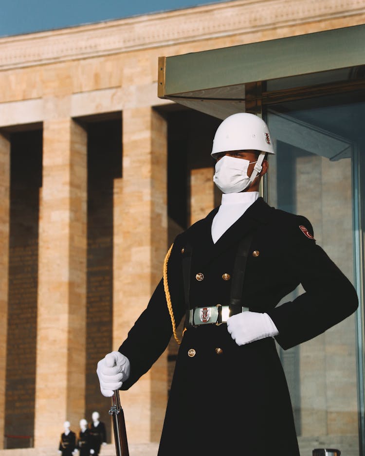 Guard Standing On Post Wearing Face Mask