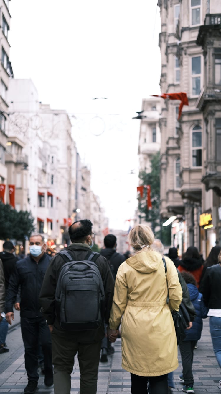 Back View Of A Couple Walking On The Street