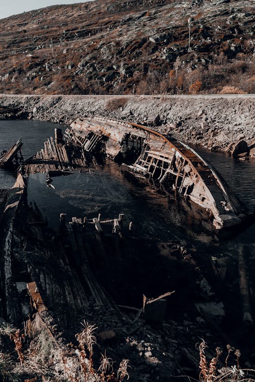 Broken Ship on the Side of the River