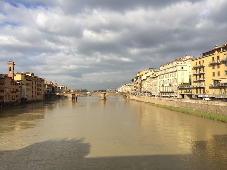 Ponte Vecchio Bridge Under Cloudy Sky