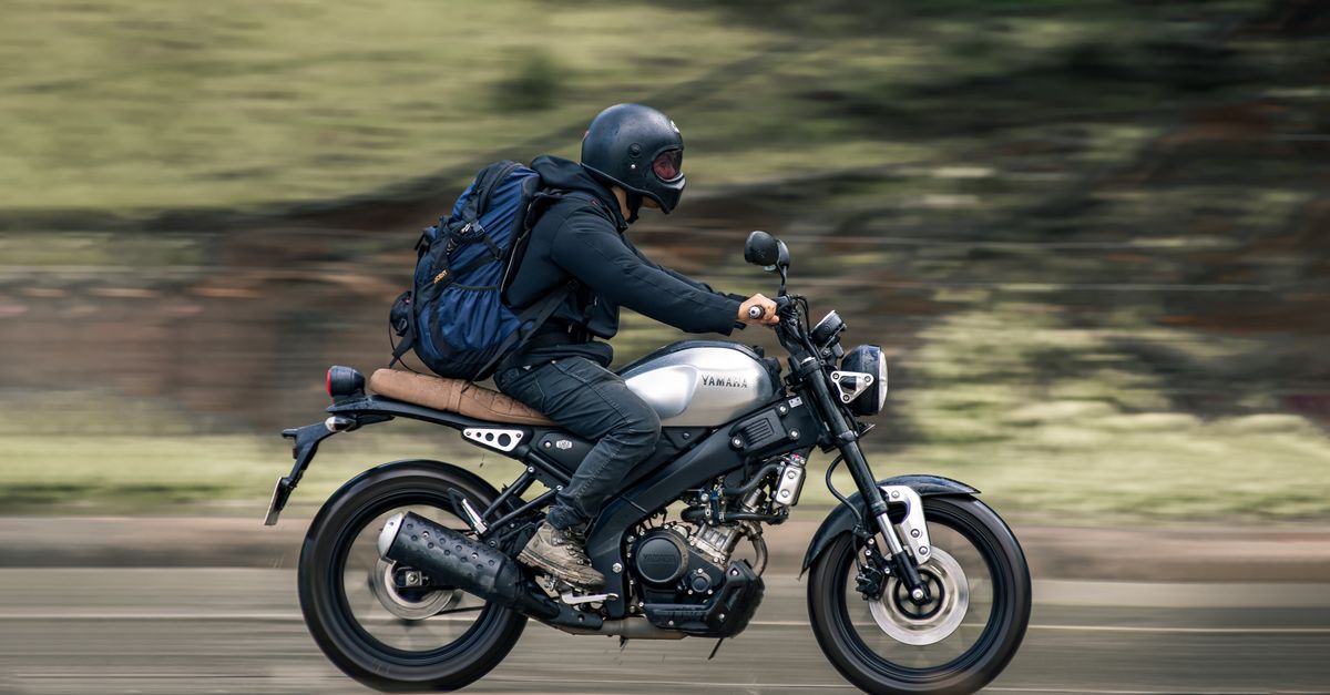 Man Riding Yamaha A Man Riding a Motorcycle · Free Stock Photo