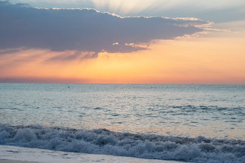 Body of Water During Dusk