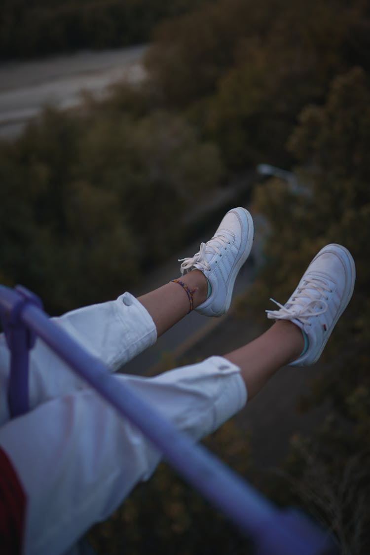 Feet Over A Woman And A Landscape Below 