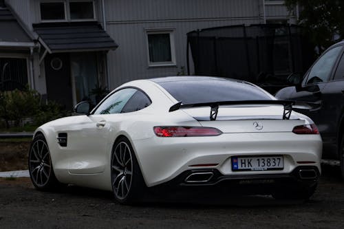  White Mercedes-Benz Parked outside a House