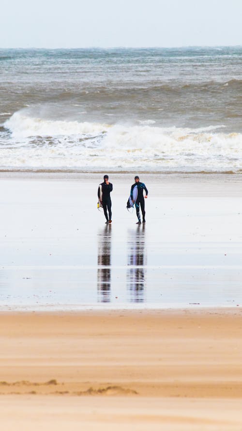 Surfboarders on the Shore