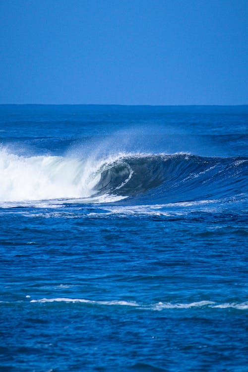 Ocean Waves Under the Blue Sky