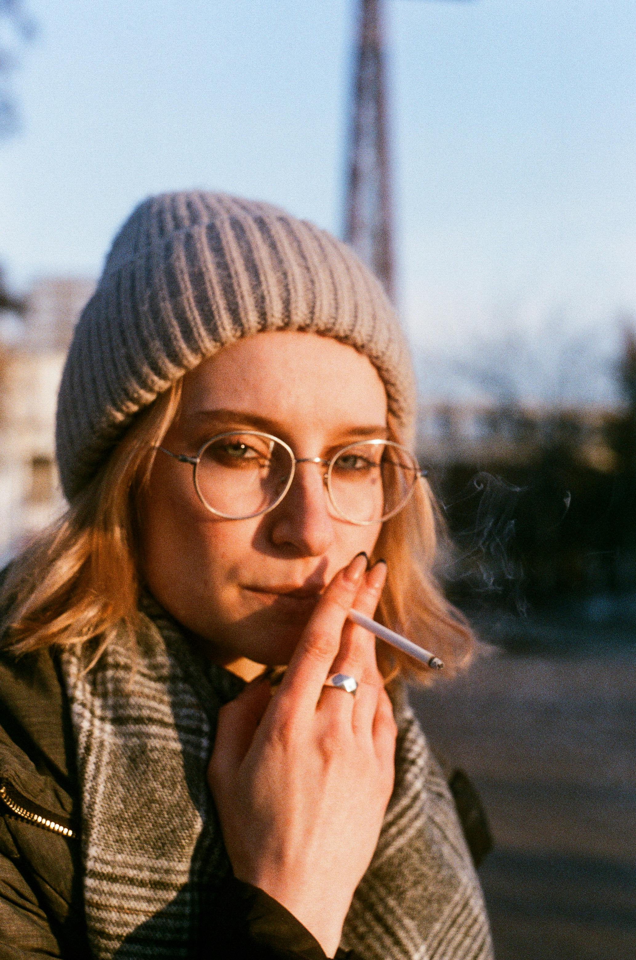 Young Woman Smoking a Cigarette · Free Stock Photo