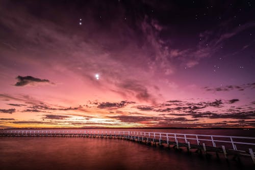 Jetty Under Starry Night Sky