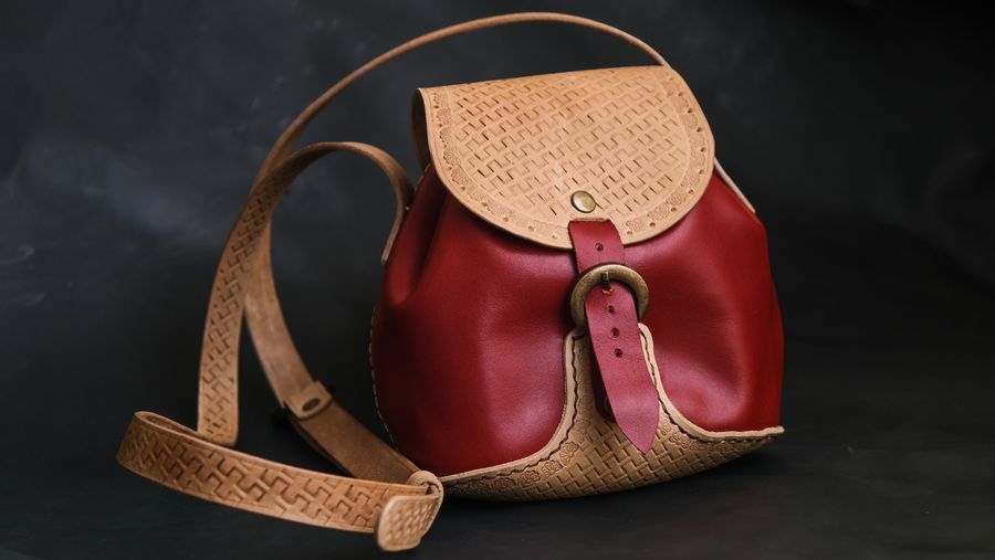 Handmade leather shoulder bag with detailed stitching