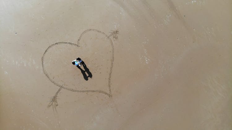 Heart Drawn On Brown Sand