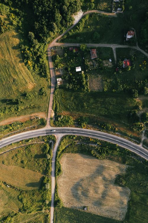 Arial View Rural Intersection Aerial view of a rural road and house · Free Stock Photo