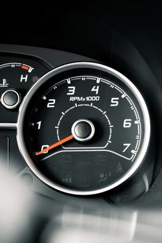 Detailed image of a car RPM gauge, showcasing vehicle control elements.